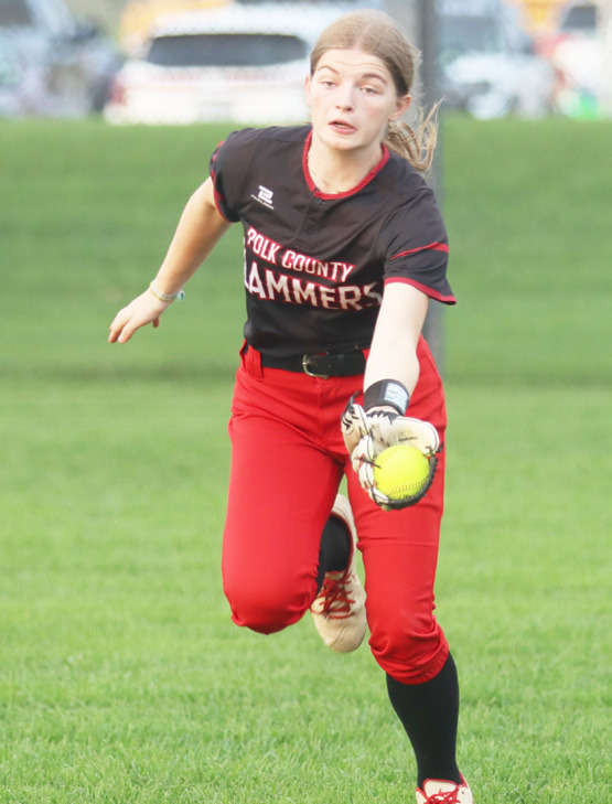 Polk County/Aquinas Slammers outfielder Jadelynn Gifford makes a running catch during the team’s Monday night game at York. PCA dropped an 8-0 final top the Dukes. Photo by Christian Horn.