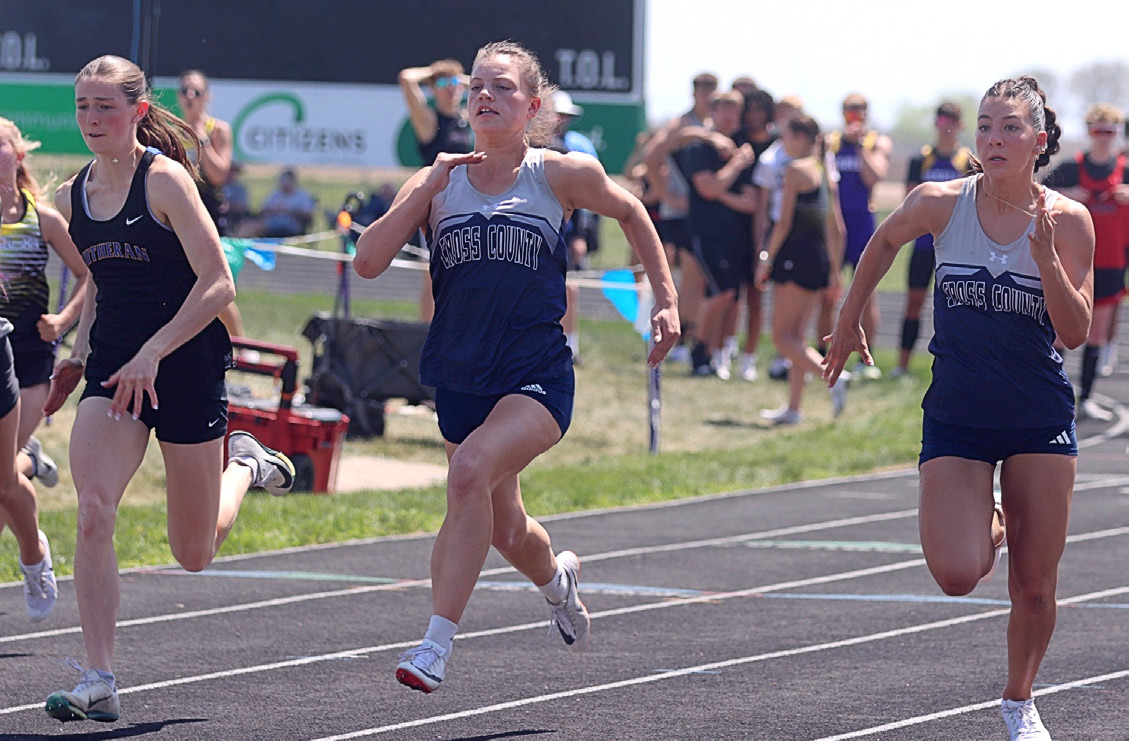 Nebraska Lutheran’s Sam Hueske and Cross County’s Ansaldi VonHackewitz and Saphira Osentowski battle in a heat of the 100 meters in Friend. VonHackewitz was third and Osentowski seventh in the finals. Photo from Christian Horn, YNT.