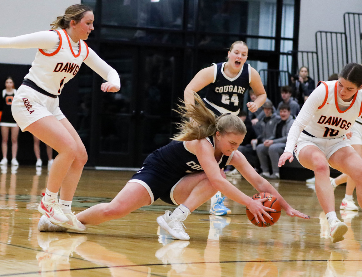 Ema Dickey (CC) dives for the ball while Emersyn Prososki (OSC), Addie Theis (OSC) and Chesney Sundberg (CC) are ready to help. PCN photo by Blaine Winslow.