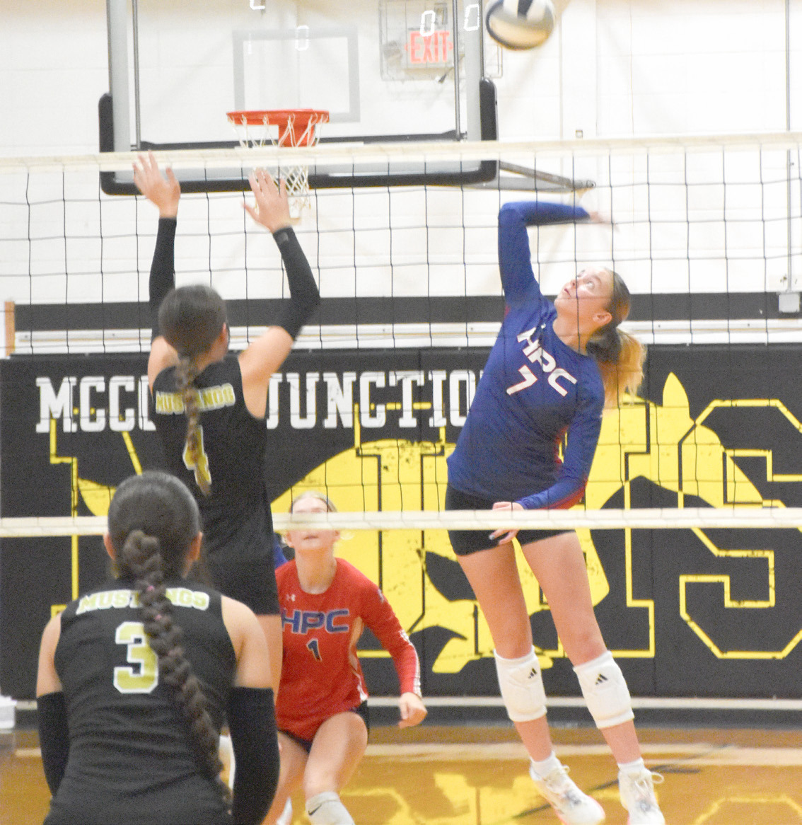 Sophomore Taya Hans (7) is on the attack as the McCool Junction Mustangs employ a single block at the net. High Plains swept past McCool Junction in CRC regular season play. PCN photo by Beth Sparrow
