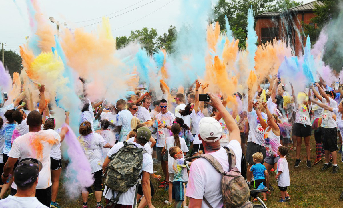 Basketball Team Holding Color Run