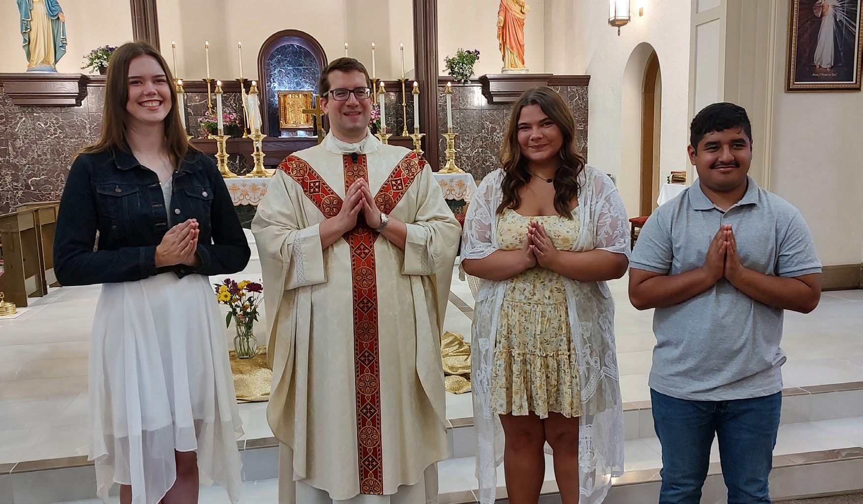 Senior Sunday was celebrated at Sacred Heart Catholic Church on Sunday, May 7th. Pictured with Father Andrew Litt are the three honored Seniors; Rachel Wacker, Jenna Logan &amp; Gustavo Vallejo.Photo provided.