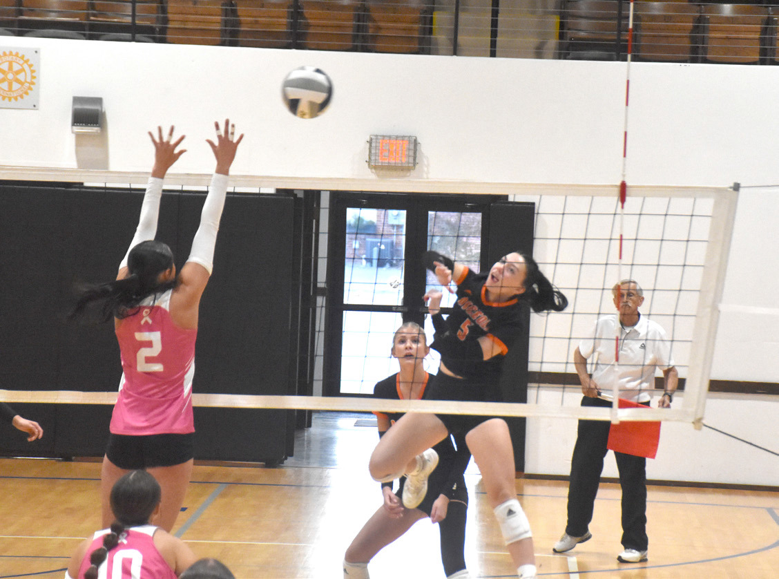 Osceola senior Camryn Peterson (5) tries to attack up and over the Dorchester defense in Saturday’s first round match with the Longhorns in York. PCN photo by Beth Sparrow