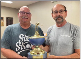 The senior center pool winners Craig Page and Mark Erhart keep the trophy at the Osceola Senior Center. They are backto- back pool champs! Photo provided.