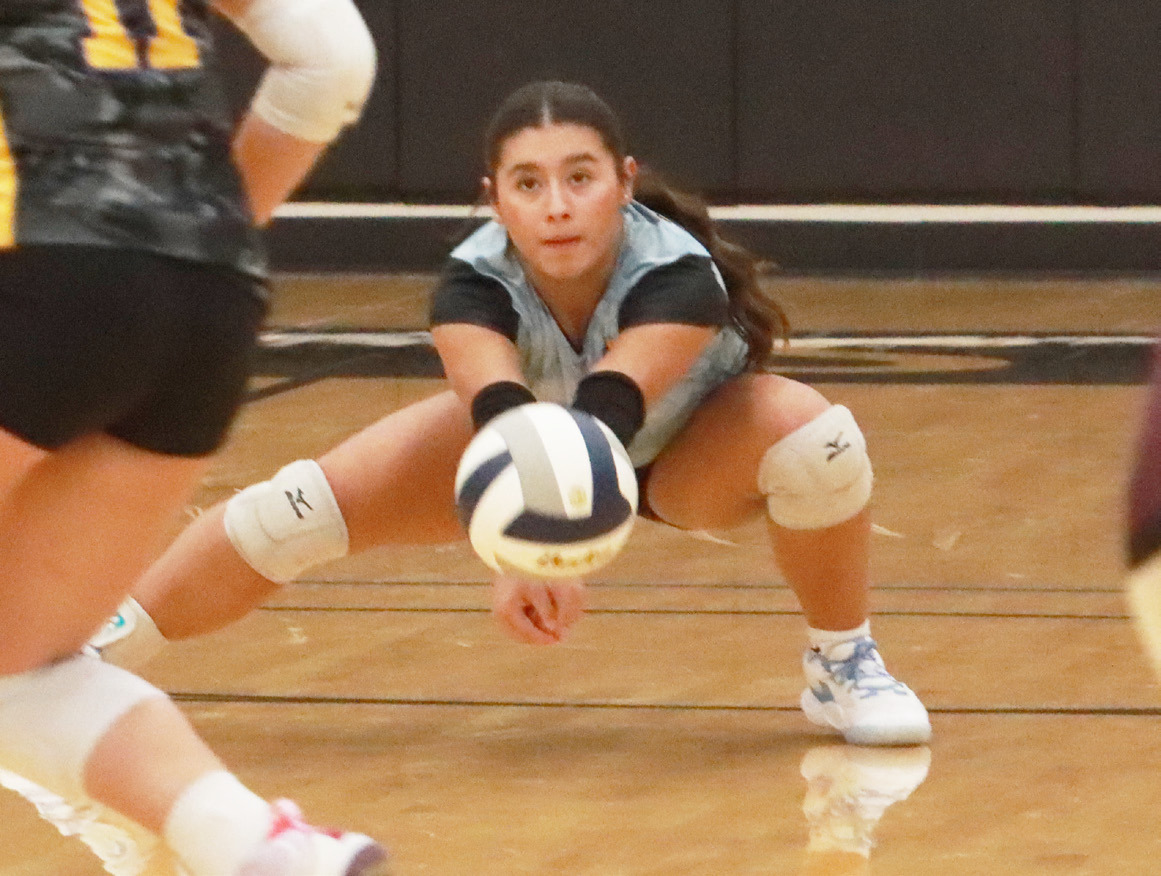 SRC’s Aleigha Escobar-Schaefer digs up the serve receive in Tuesday’s night match with Arlington. PCN photo by Ken Kush.