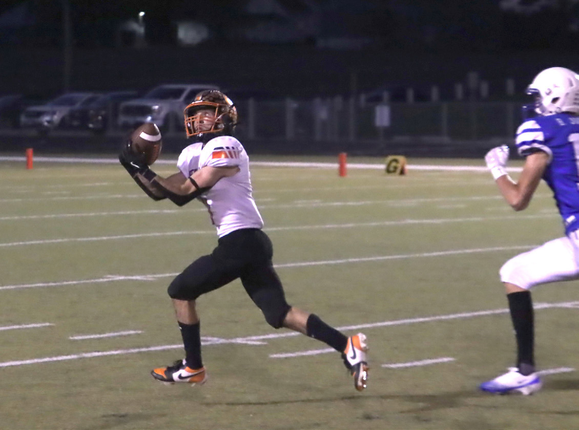Osceola senior Brayden Santos hauls in a 48-yard completion in the first half leading to the Bulldogs first touchdown two plays later. Santos caught a 50-yard scoring strike in the second half. PCN photo by Ken Kush.