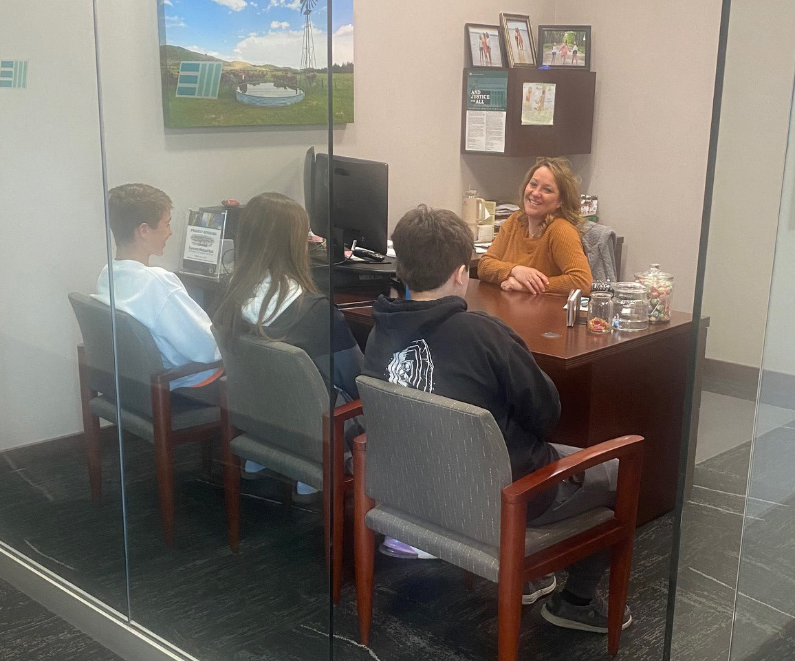 Osceola sophomores visit with Casey Tonniges of Edgewater Insurance for job shadow day. Photo provided.