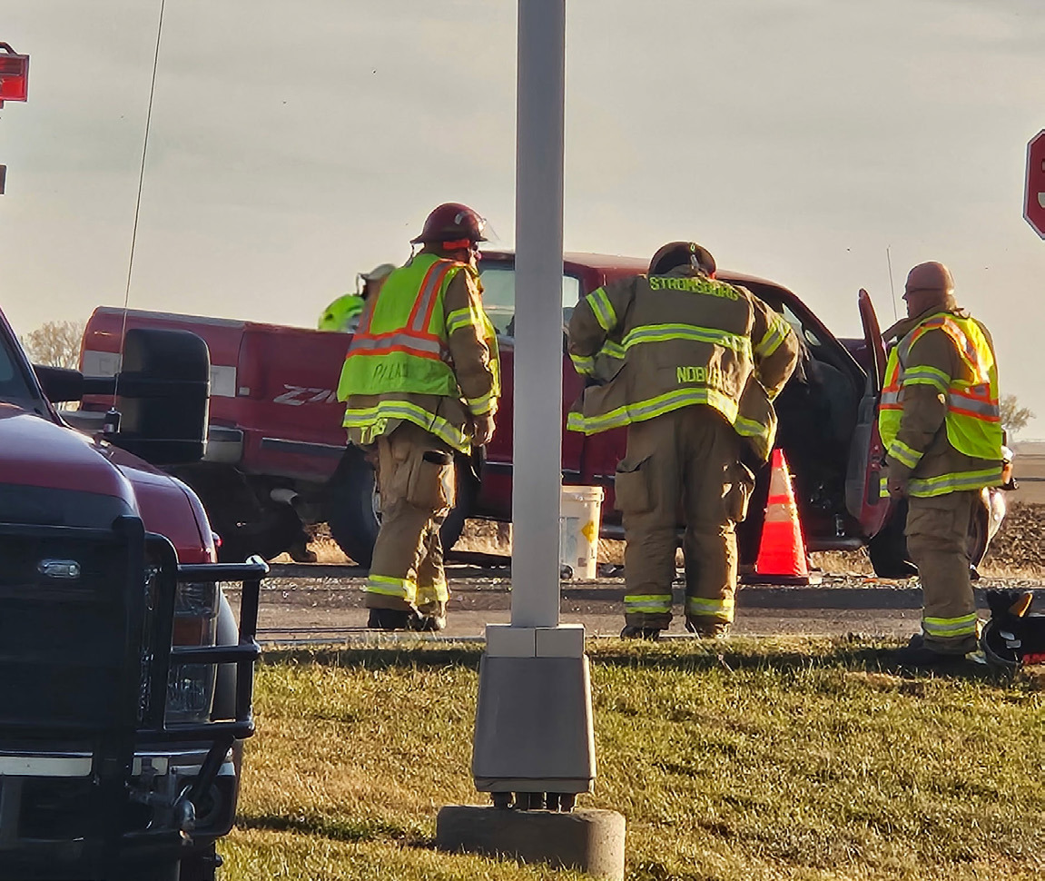 Above: Firemen help with a 2-car accident Tuesday afternoon at Cross County. Photo provided.