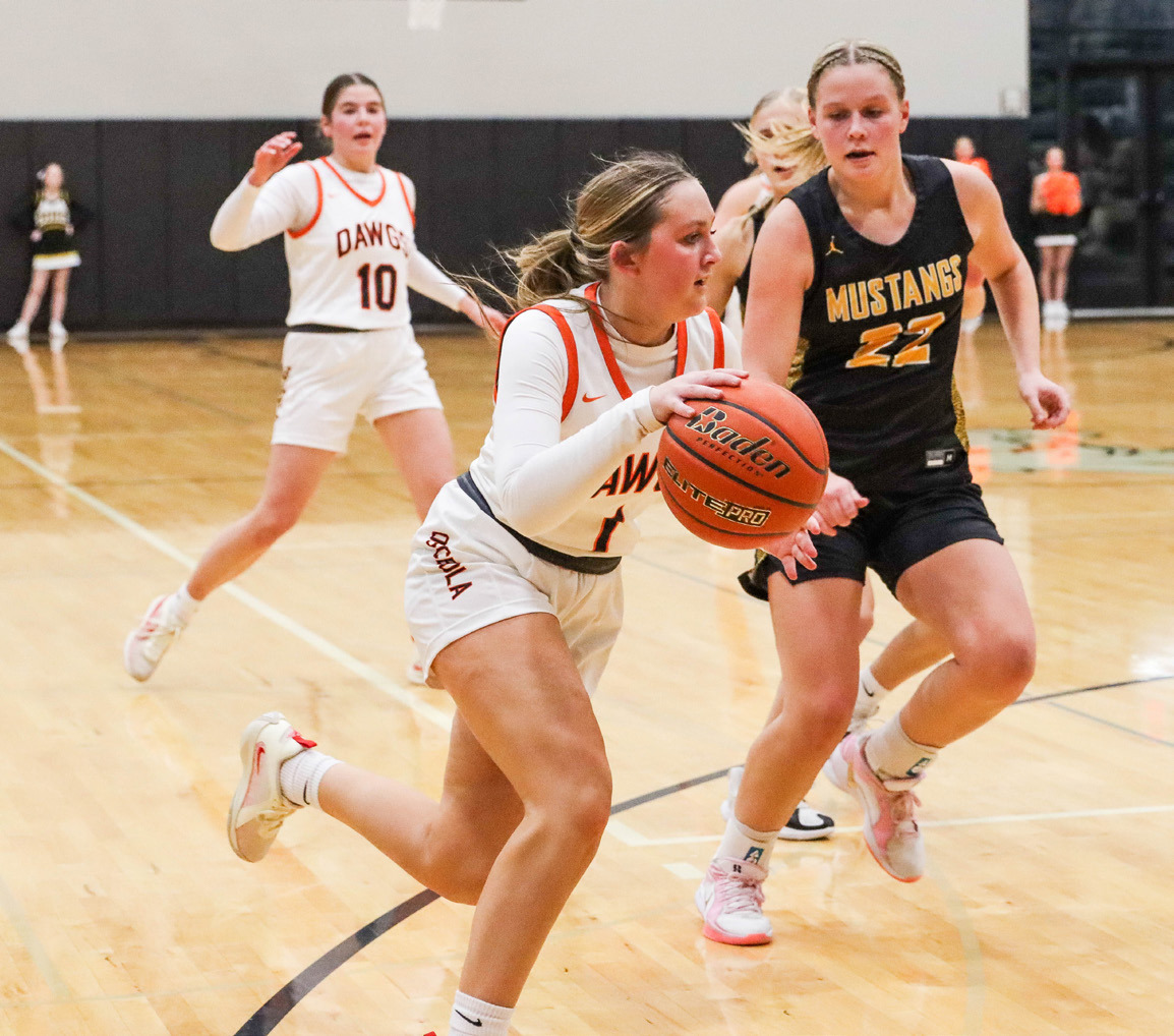 Emersyn Prososki dribbles the ball past a Mustang in their game last week. PCN photo by Blaine Winslow.