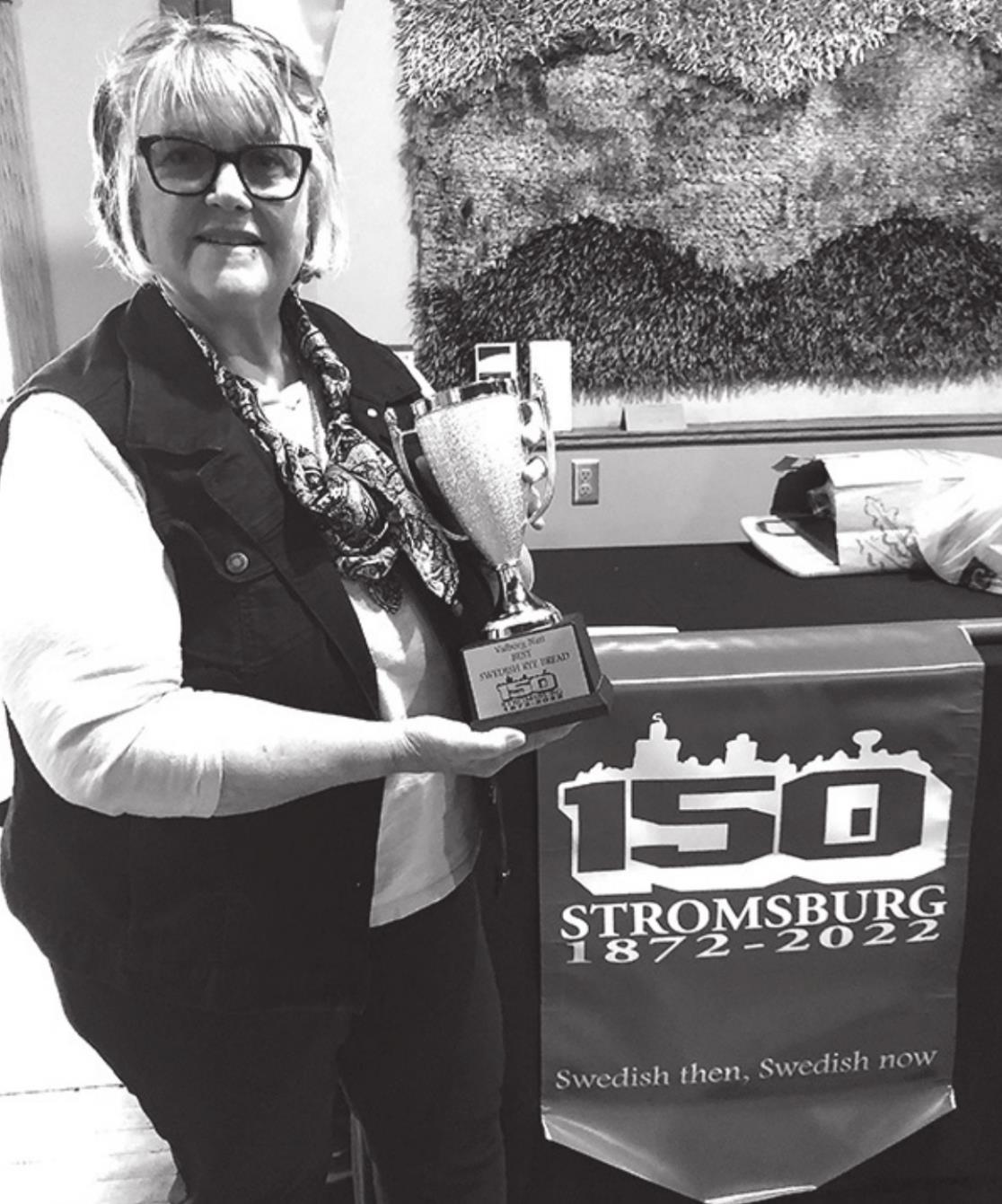 Marla Teegerstrom was the winner of the rye bread baking contest. Here she is with her trophy. Photo courtesy of Richard Collins.