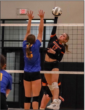 Alexis Burritt with the kill against Nebraska Lutheran. PCN photo by Blaine Winslow.