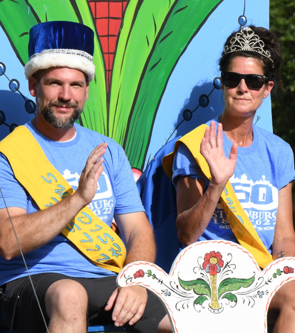 King Joel Linn and Barb Fowler ride atop their royal float during the Swedish Festival parade on Saturday. Photo by Rick Holtz