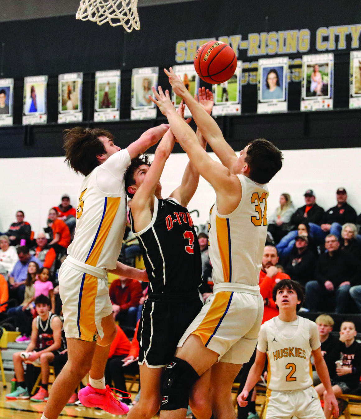 Kelby Neujahr tries to shoot while Blake Schmidt and Dylan Micek defend. PCN photo by Blaine Winslow.
