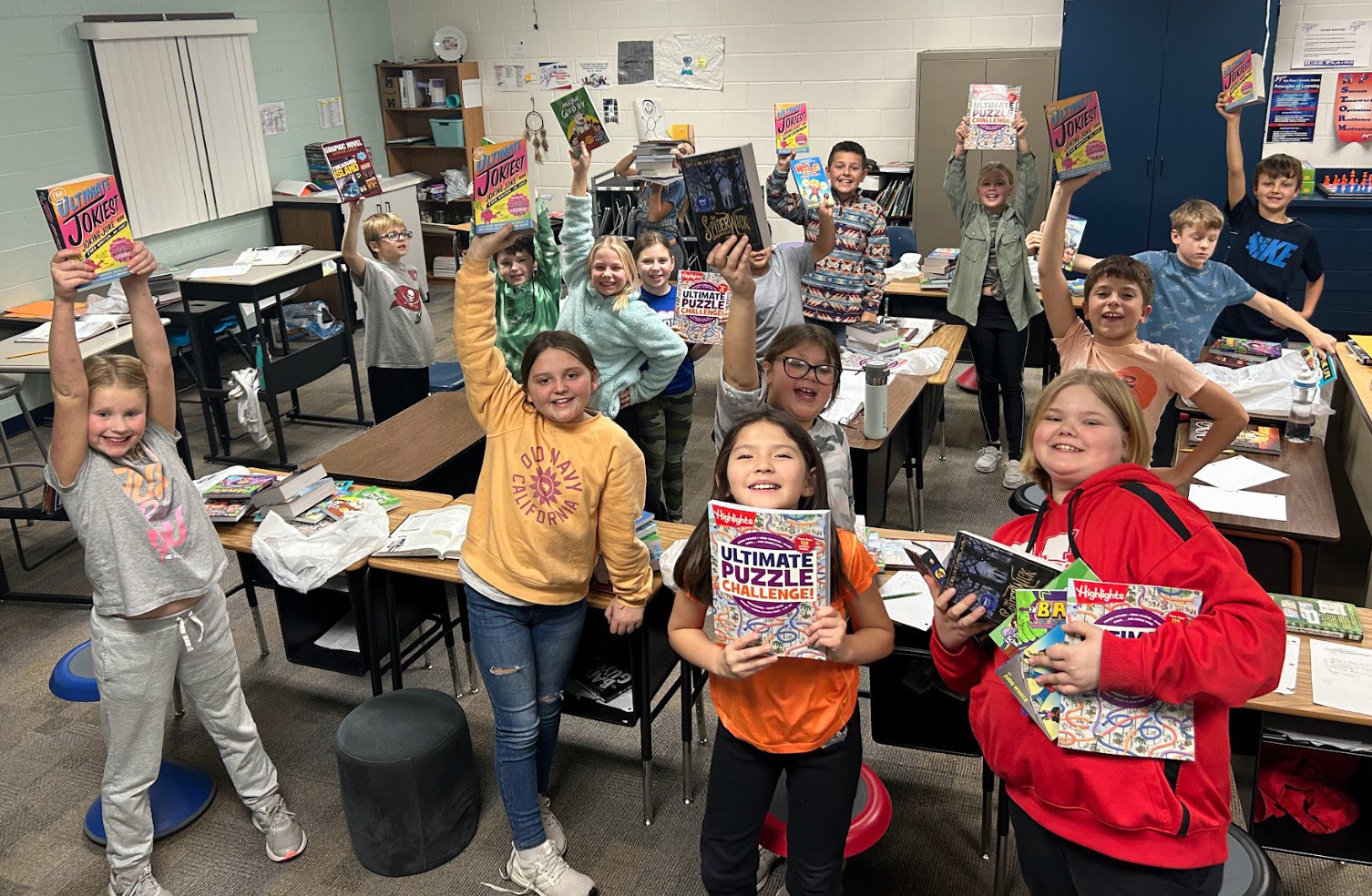 Because of several generous donors, the High Plains Community School was able to raise $13,100 for the Book Blast. This money will go directly to the students to build their home libraries. Above and Below: High Plains Elementary students proudly display their new books.
