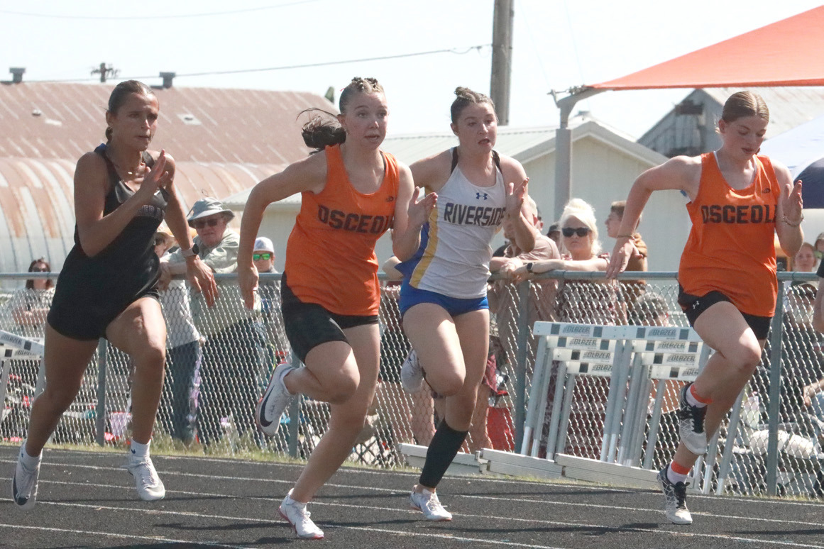 The finals of the girls 100 meters was won by Natalie Laubers (far left) with Osceola’s Camryn Peterson (next to her) taking second. Also pictured is Riverside’s Ella Molt and Osceola’s Jadelynn Gifford (far right). Laubers and Peterson both qualified for state. PCN photo by Ken Kush.