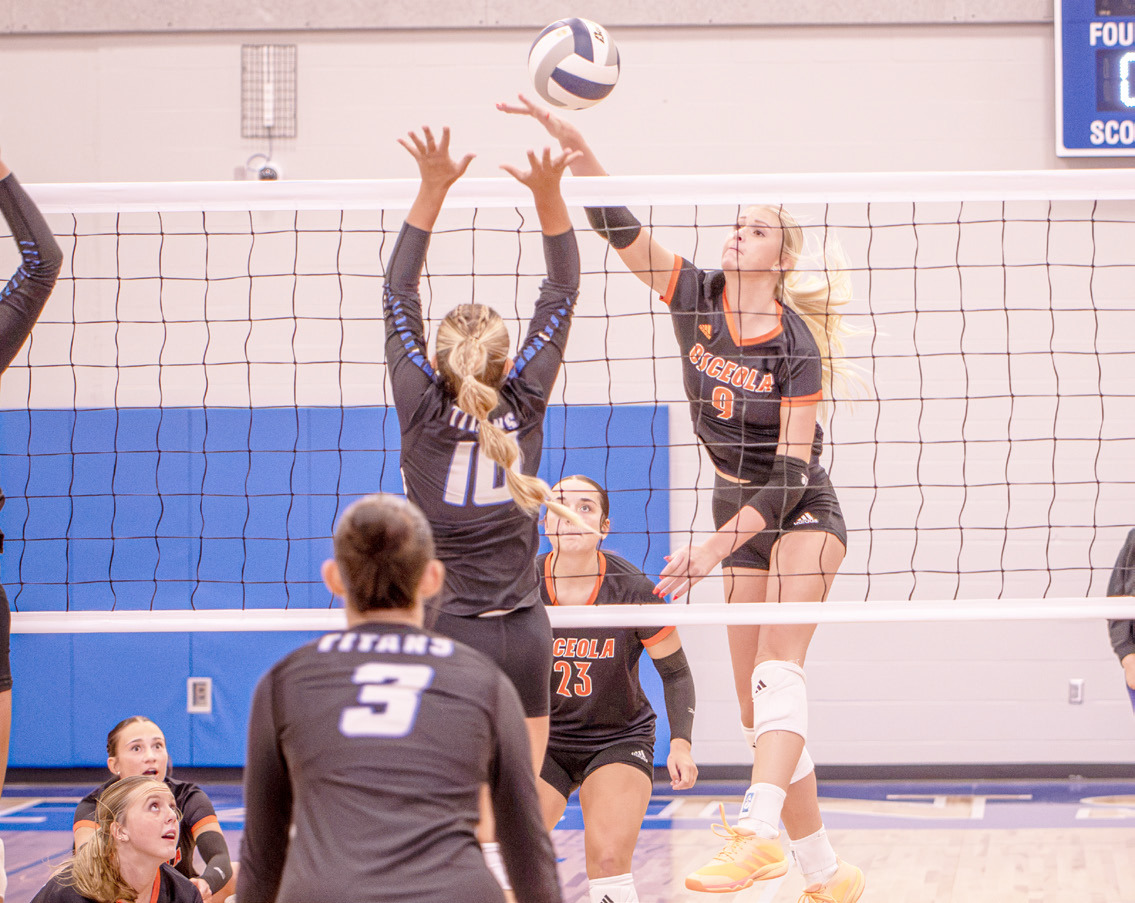 Osceola senior Kenzie Bartling (9) send the attack into the teeth of the Twin River block in Thursday action in Genoa. Bartling had eight kills in the 3-0 win. PCN photo by Rick Holtz.