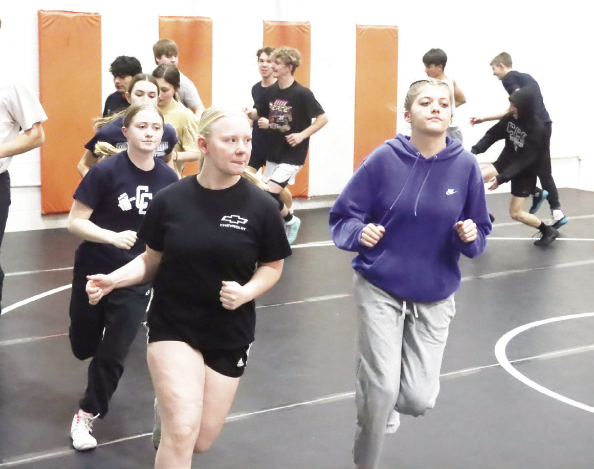 The Cross County/Osceola Twisters girls wrestling team gets in their running at Tuesday’s practice held at the Osceola Auditorium. Both the girls and the boys teams are practicing at the Auditorium at the same time. PCN photo by Ken Kush.