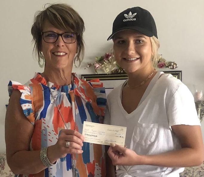 Taylor Carlson (right) receives a scholarship from Chapter CN. Representing CN is Luanne Bond. Photo provided.