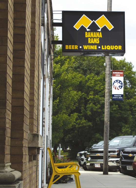 Above left: The Banana Rams bar sign in Hordville. Right: Justin Blase, owner. Photos by Pierce Gentry, Flatwater Free Press.