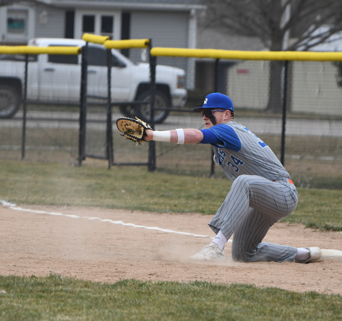Kale Gustafson goes for the catch on first base. PCN photo by Rick Holtz.