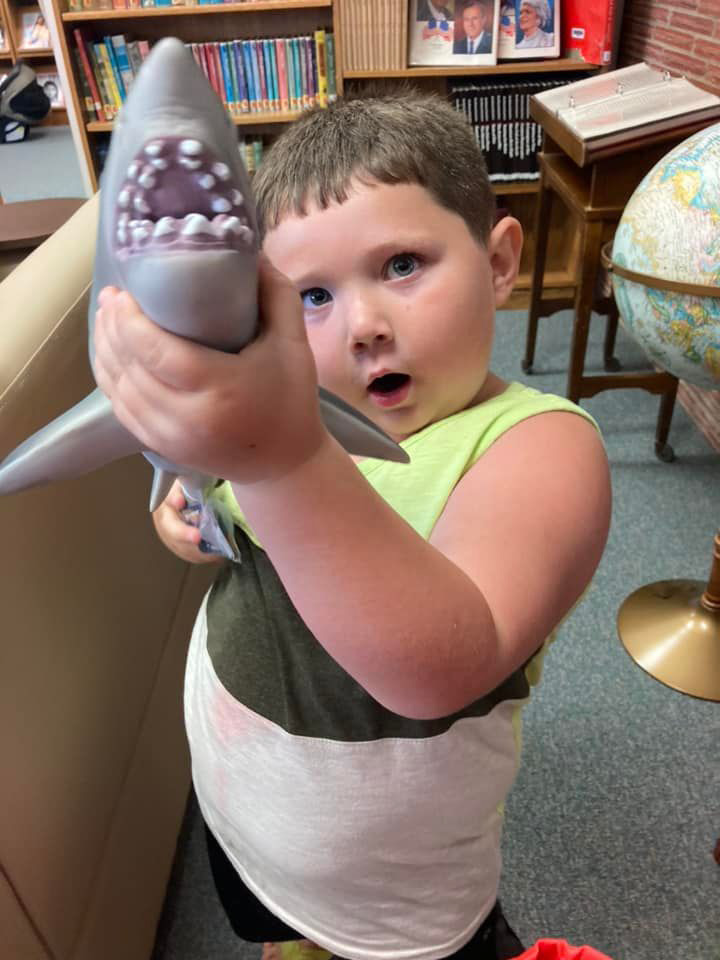 Pictured is Greyson Klein with his summer reading prize. Photo provided.