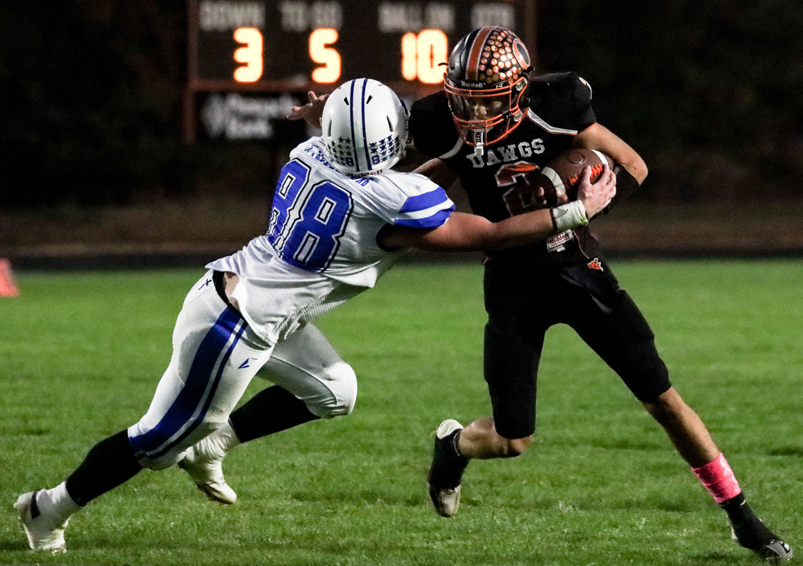 Jackson Winslow runs the ball against Archangels Catholic. PCN photo by Blaine Winslow.