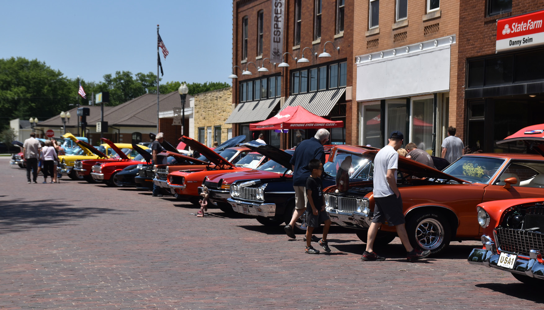 The car show on Sunday drew many fathers out. Others enjoyed the food trucks, such as ice cream on a hot afternoon. PCN photo by Beth Sparrow.