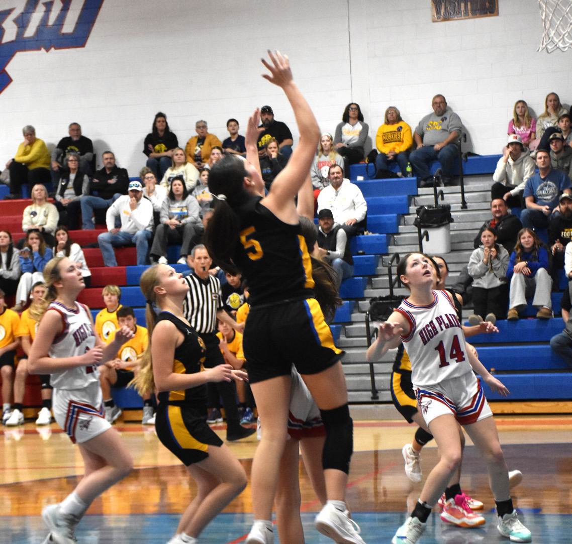 Junior Kaleigh Ruth (5) drives to the basket. Ruth scored eight of her 13 points in OT and she hauled in 14 rebounds in the Huskies win on Saturday. PCN photo by Beth Sparrow.