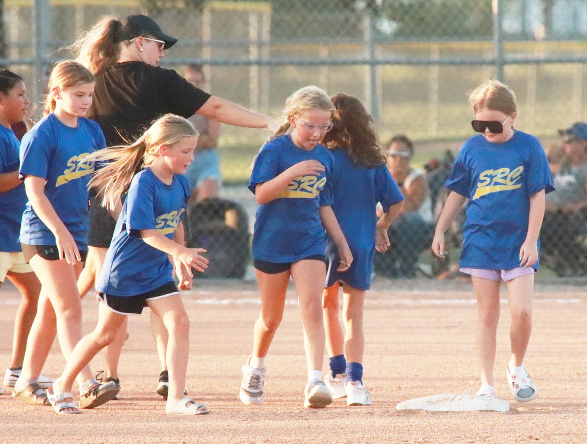 Just before the start of the Columbus Lakeview-Blue River Softball game young girls softball players from Shelby-RC, East Butler and David City were recognized. Here several SRC girls are on the field. PCN photo by Ken Kush