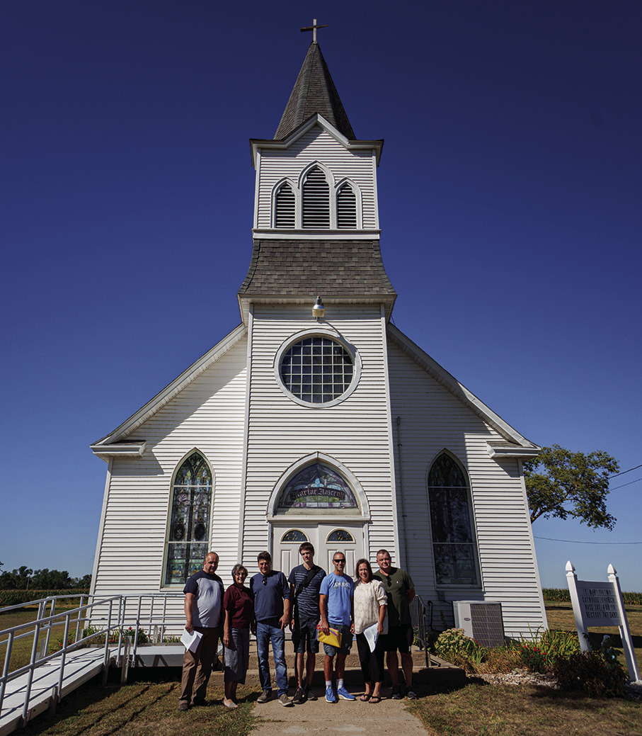 Pictured from left: Andrzej Tarczon, Marge Rinkol of Columbus, Bogdan Placek, Krzysztof Kosowski, Bartlomiej Chlopik, Denise Ingalls of Columbus, and Piotr Kosowski visiting St. Mary’s Pilzno Church in northern Polk County. Photo provided by Nance County Journal.