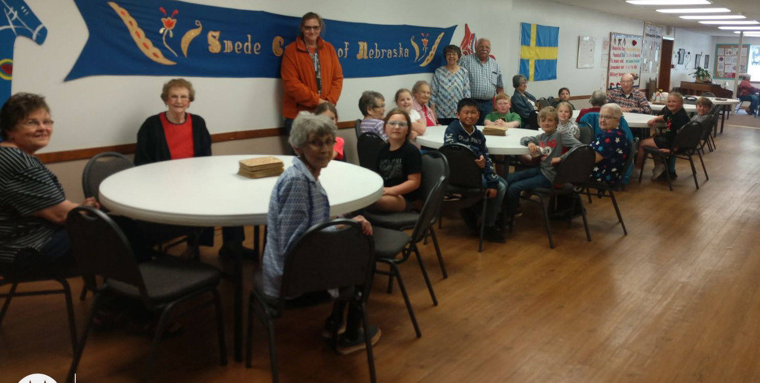 Pictured are third graders visiting the senior center. Standing in the middle is their teacher Mrs. Ericson. Photo provided.