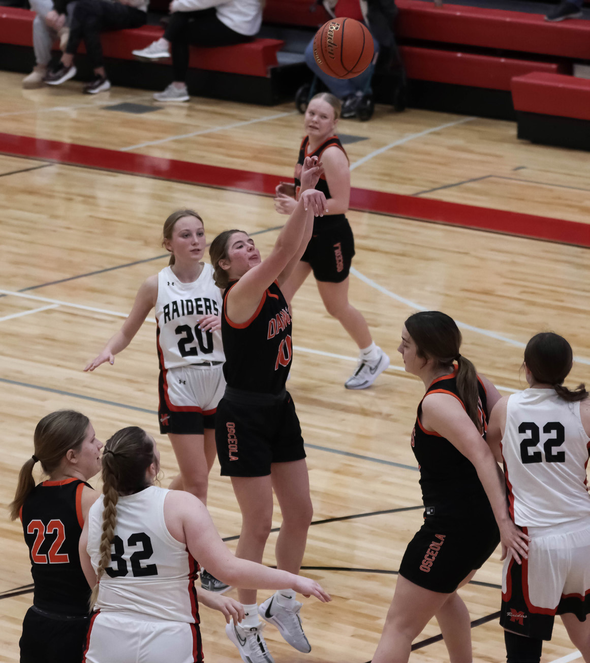 Addison Theis takes the shot against Mead while teammates Bella Recker and Melinn Roberts block. PCN photo by Blaine Winslow.