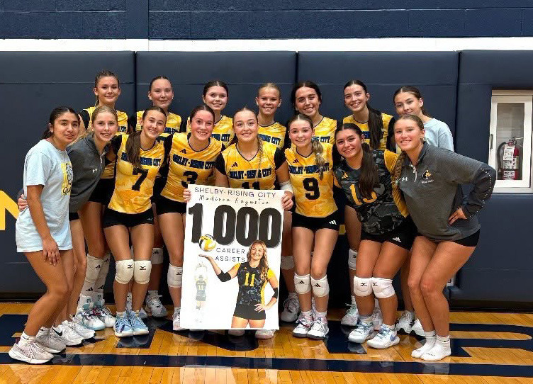 Pictured here with her team, junior Madison Augustin celebrates her 1,000th career set assists at Raymond Central High School. Photos provided