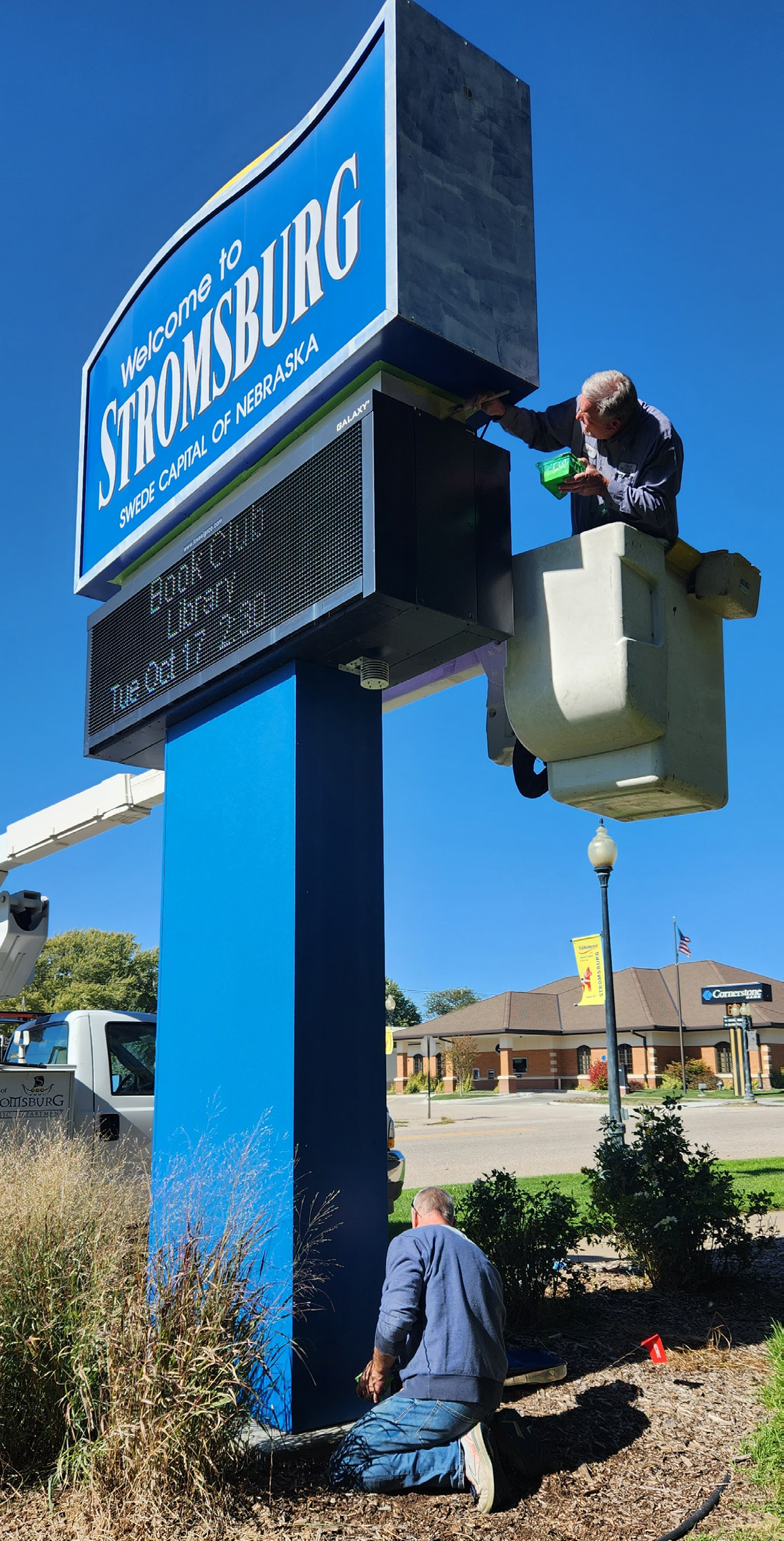 Jeff Branting painted from the city’s bucket truck and Troy Lindsley finished up the bottom portion of the painting. Photo provided by Cinda Koinzan.