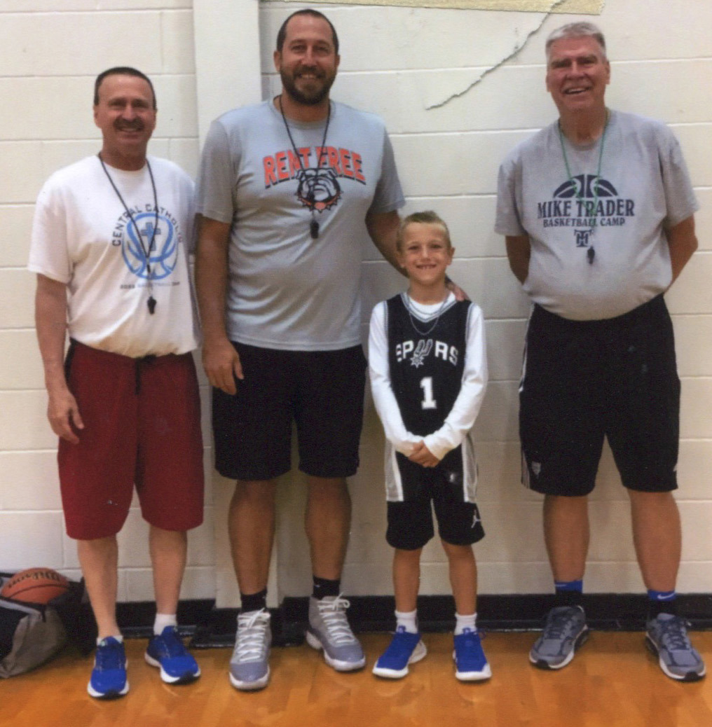 Jeter Zelasney attended the Mid-America Basketball Camp this summer. He was in the boys’ midget league and was a leader in assists. Pictured here is Coach Gavers, Coach Jason Zelasney (his dad), Jeter and Coach Trader. Photo provided.