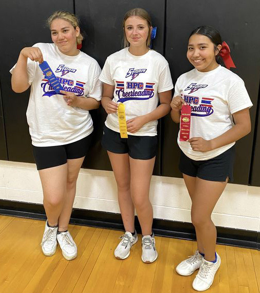 These three girls earned camp awards: (left to right) Samantha Ertzner for super spirit, Ashtyn Quast for all-around and Lily Sanchez for stunting. Great job girls! Photo provided.