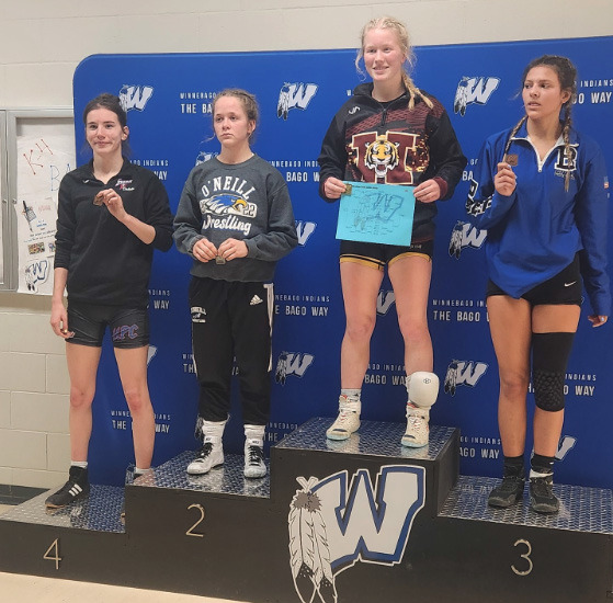 Dakota Gress (far left) placed 4th at a tough Winnebago meet for girls’ wrestling. Photo provided.
