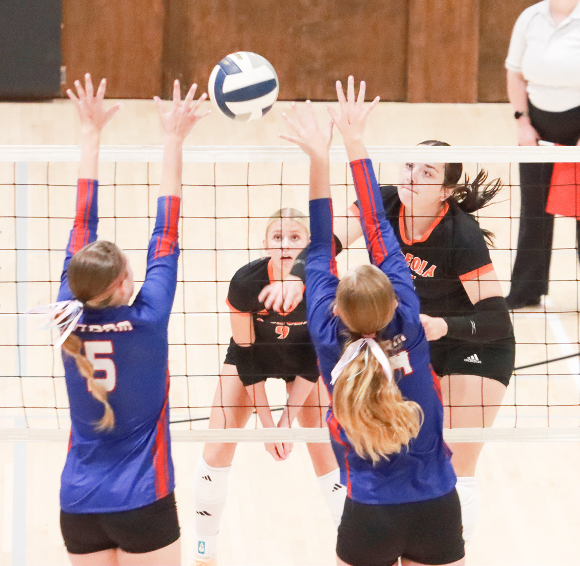 Osceola senior Bella Recker powers the attack into the High Plains block during Monday night’s CRC semifinals at the York City Auditorium. PCN photo by Ken Kush.