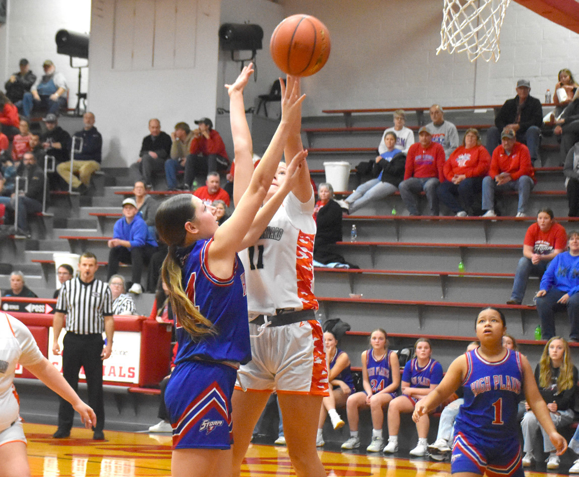High Plains freshman Brooklyn Welch (14) puts up the shot against the Giltner/Harvard defender during Friday night’s game in Harvard. PCN photo by Beth Sparrow.