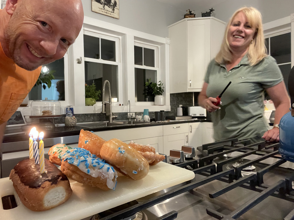 Michael Rheiner (left) and his wife Tammie enjoy some donuts from the local donut shop. Photo provided.