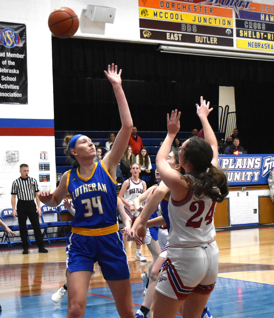 Rylee Ackerson shoots one over her taller opponent, Marissa Endorf of Neb. Lutheran. PCN photo by Beth Sparrow