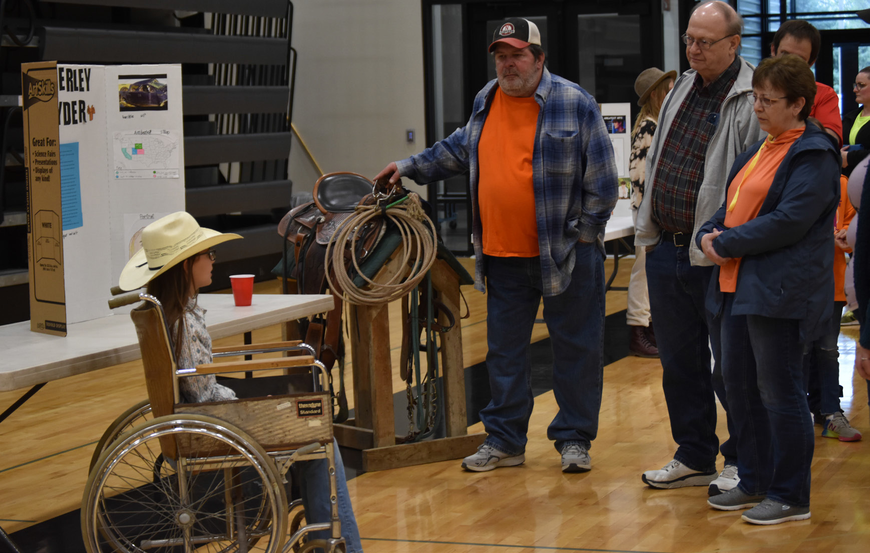 ABOVE: A group gathers to hear Emilia Pliefke portray professional barrel racer Amberley Snyder at the 5th Grade Wax Museum on Thursday, April 25.