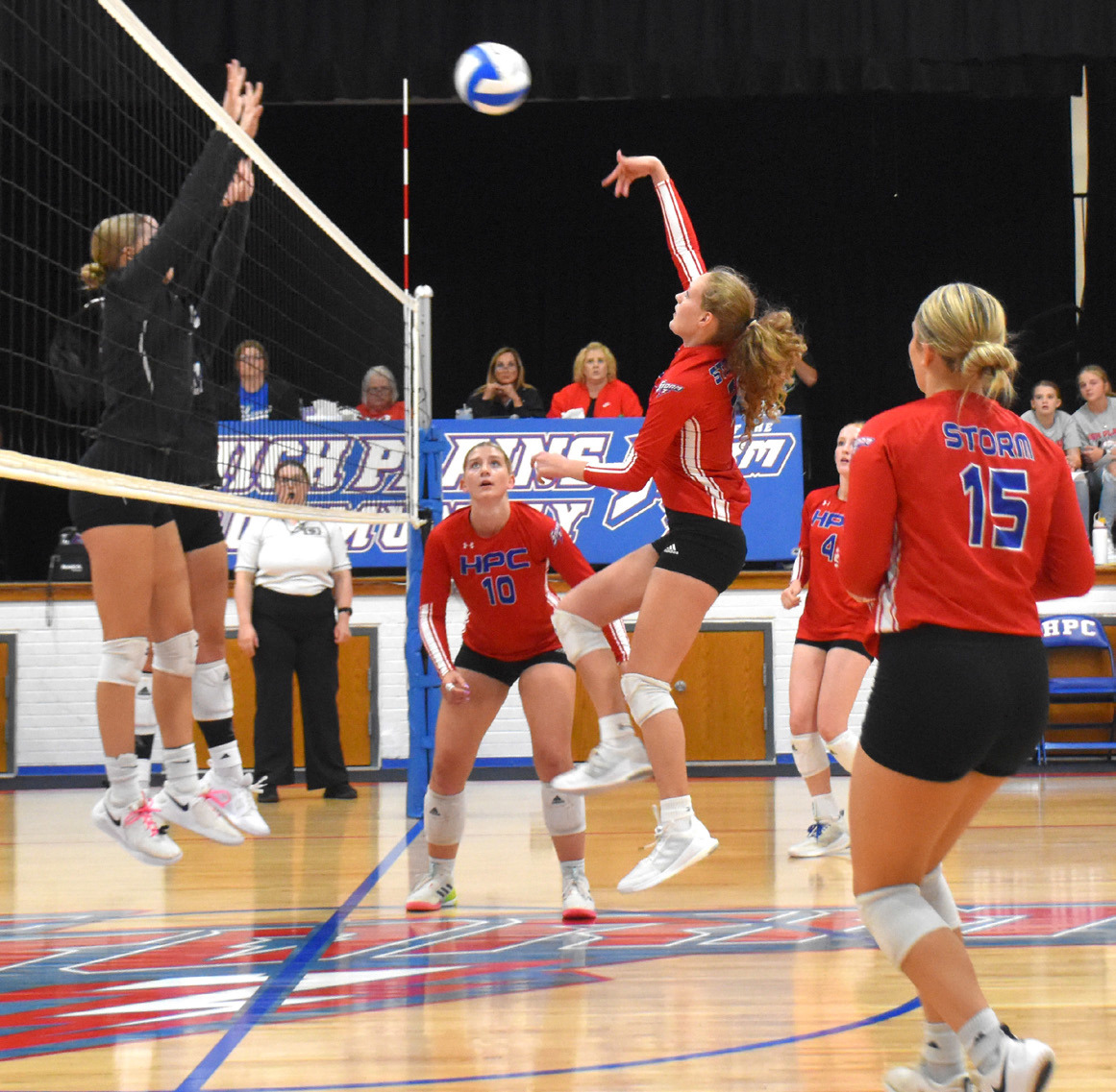 Rylee Hofmann hits one up to the Titan’s block. PCN photo by Beth Sparrow
