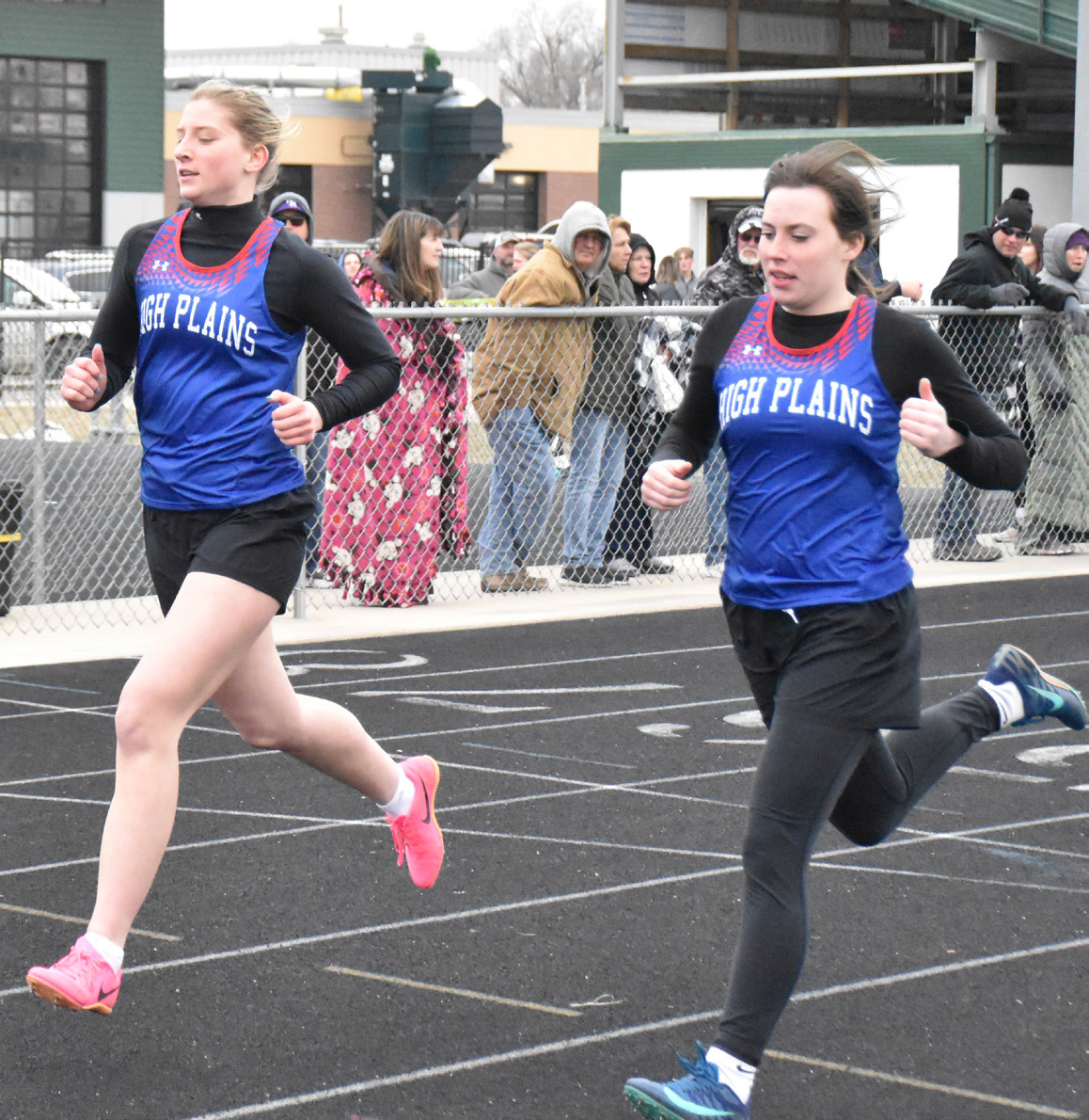 Courtney Carlstrom and DeAnnah Swanson run in the 200-meter dash. PCN file photo by Beth Sparrow.