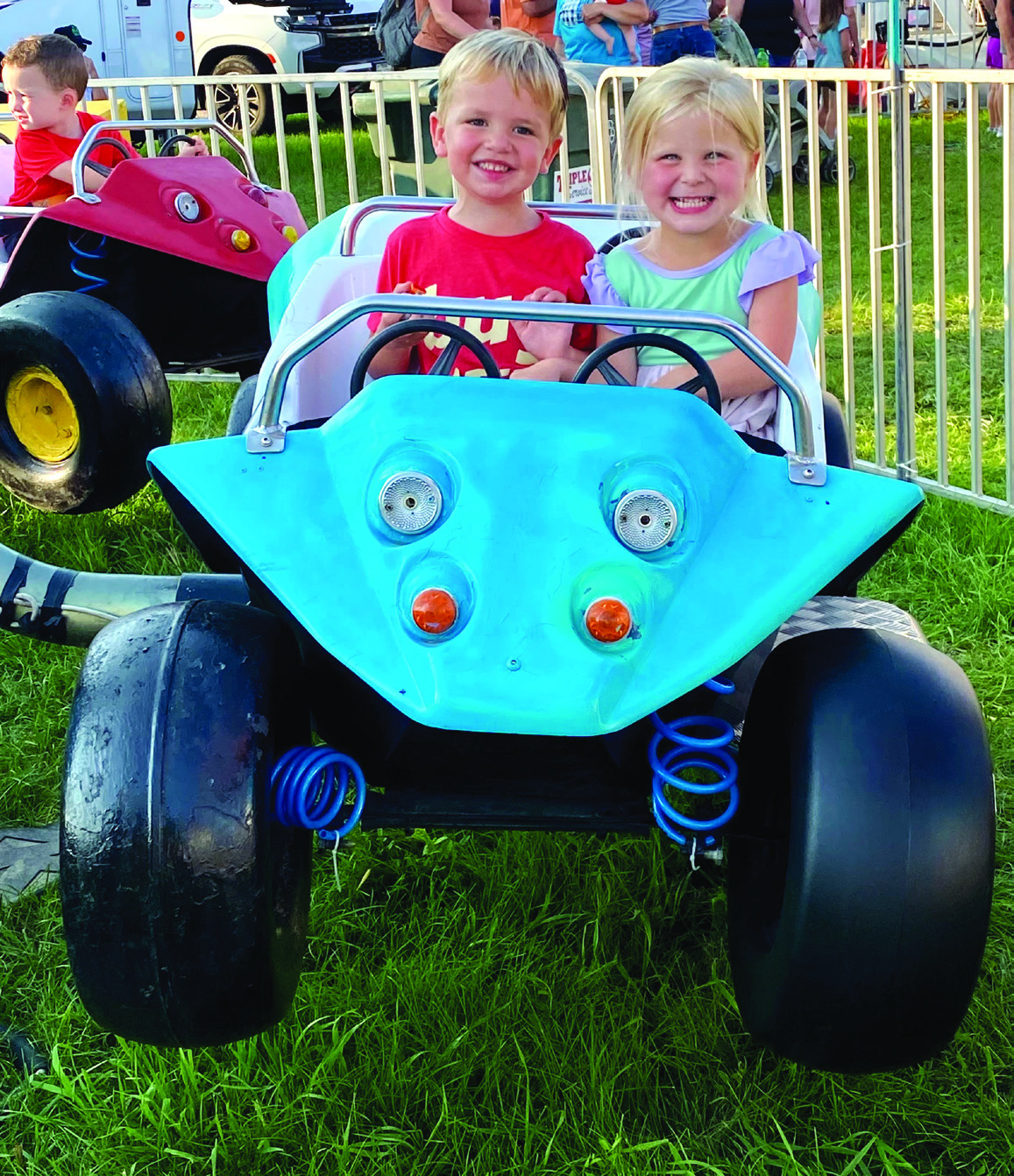 These two cuties enjoyed a “car” ride at the fair. PCN photo by Lexi Reimers.