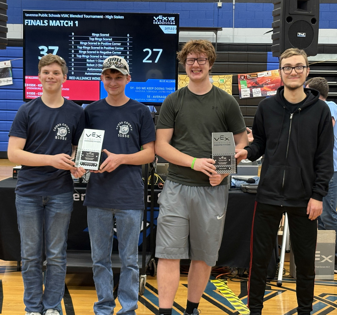 Team 5155K (right) qualified for state robotics on Saturday winning the tourney with 5155E (who was already qualified). Pictured is (left to right) Sam Haug, Marshall Johansen (5155E) and Cannen Mooney, Kirk Sparrow (5155K). PCN photo by Beth Sparrow.