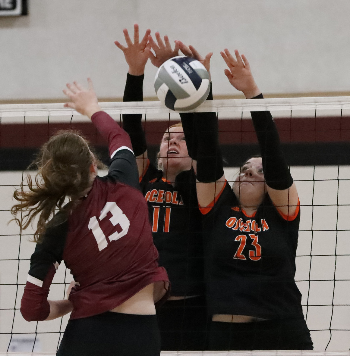 Eastyn Kropatsch and Bella Recker go up for the block against Heartland. PCN photo by Blaine Winslow.