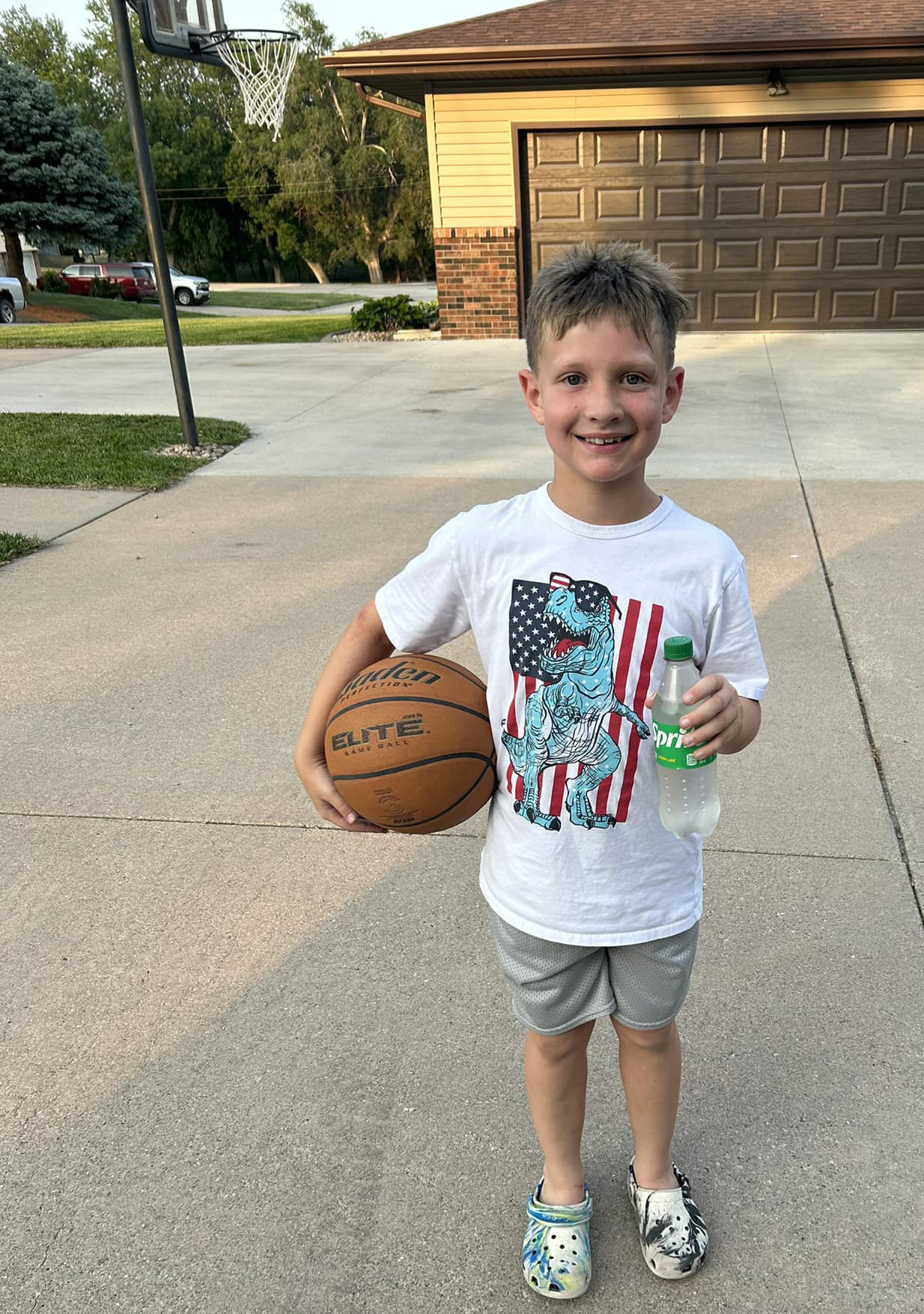 Coach Jason Zelasney (JZ) and Coach Webster are on the prowl this summer, catching kids shooting hoops. Similar to “Shoot for a Scoop”, now it’s “Shot for a Pop”. If you are caught, you get a pop or Gatorade. This is for all school age boys and girls that attend Osceola Public Schools. Parents, you may contact them and let them know when your child is out shooting (especially out of town kids). Pictured is the first winner, Quin! Photo provided.