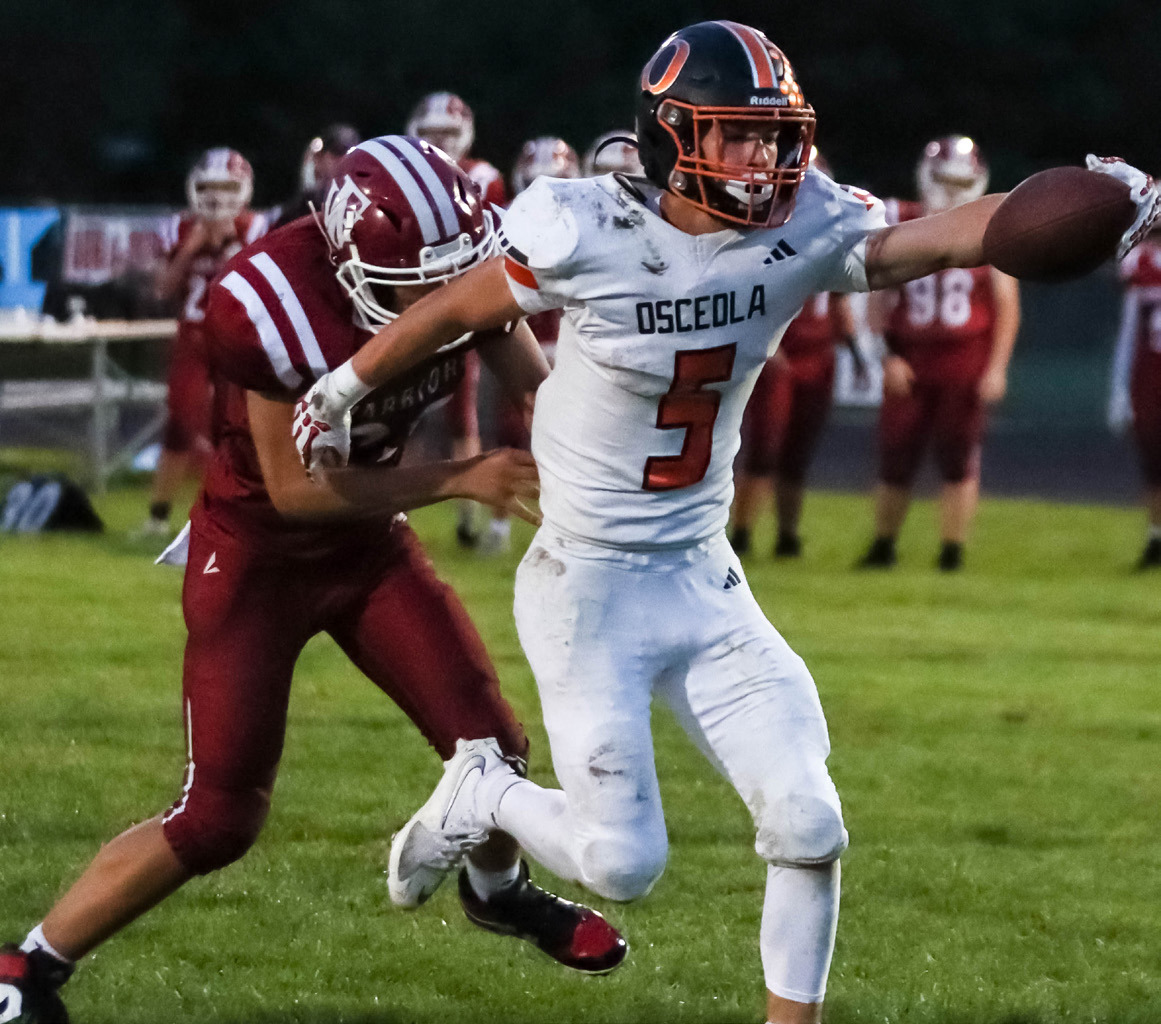Osceola junior Brycen Kula (5) reaches out to stretch the ball past the goal line. Kula ran for six touchdowns and 327 yards in Osceola 46-14 win at Fullerton. PCN photo by Blaine Winslow.