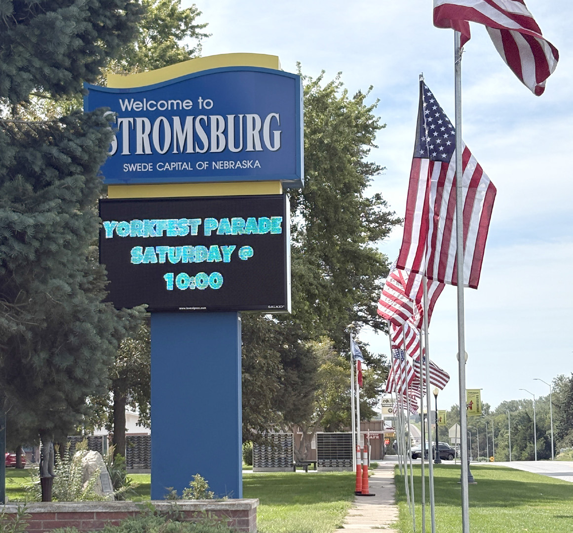 Stromsburg has a new sign on the highway with a larger display as shown on Friday with the flags. PCN photo by Beth Sparrow.